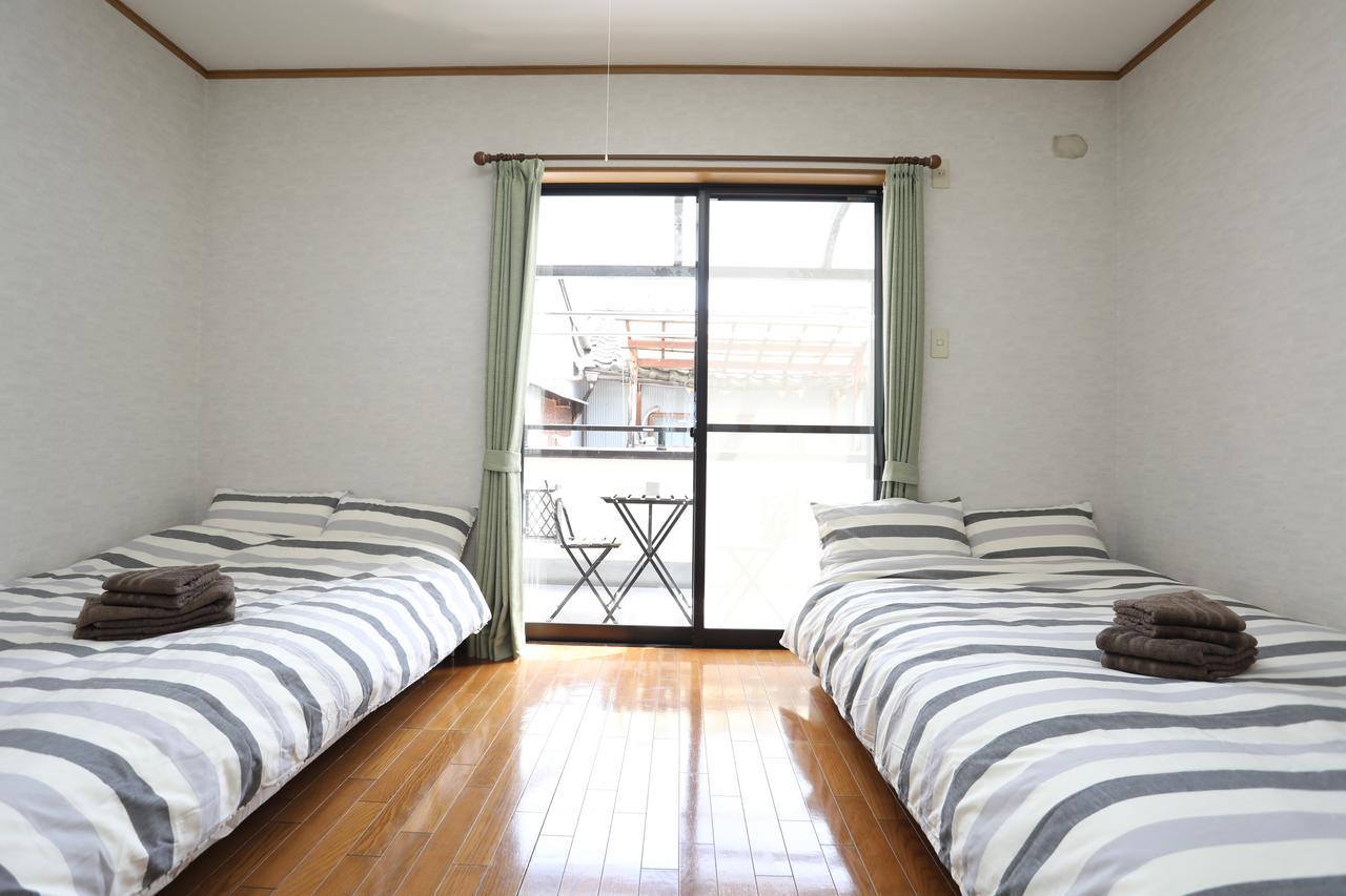 Yamanoyado Tsuru Pension Osaka Buitenkant foto