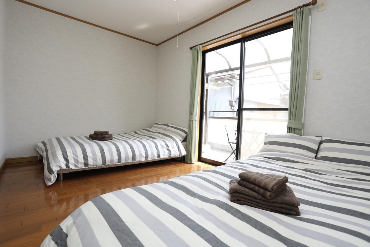 Yamanoyado Tsuru Pension Osaka Buitenkant foto